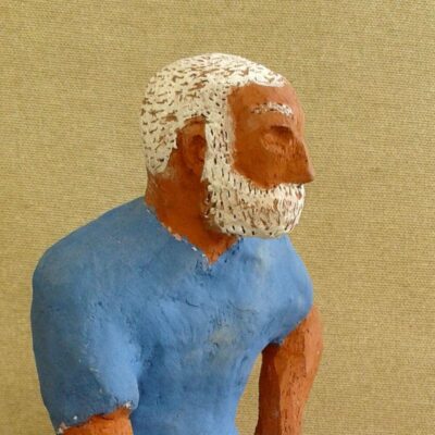 Naive ceramic sculpture; Hemingway, The Old Man and the Sea. Ceramic figure. Close-up of head and shoulders