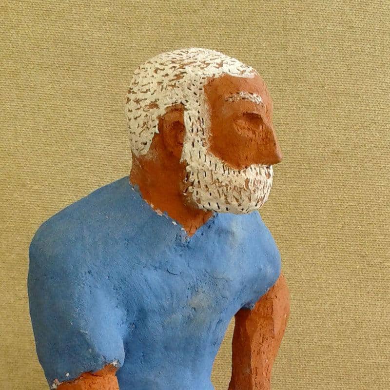 Naive ceramic sculpture; Hemingway, The Old Man and the Sea. Ceramic figure. Close-up of head and shoulders